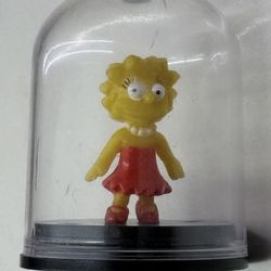 Lisa Simpson figurine encased in a clear dome