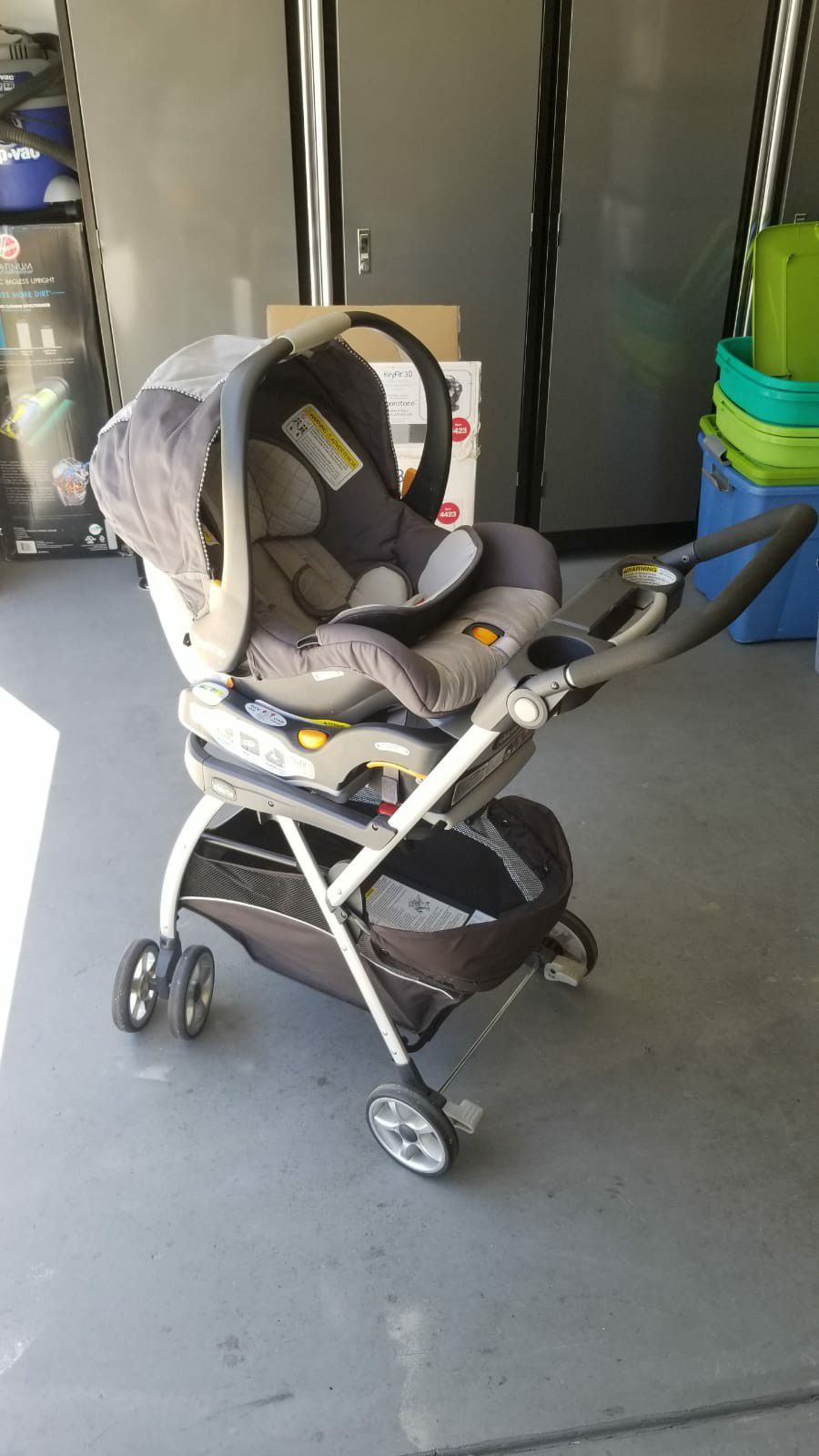 Almost new Chicco brand carseat with base and frame stroller.