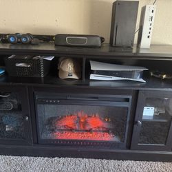 TV stand with electrical fireplace. 