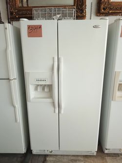 Whirlpool Side by Side Refrigerator White excellent condition . Warranty , Delivery available 2203 Fowler st. Ft. Myers 33901