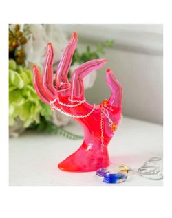Pink hand, jewelry display stand