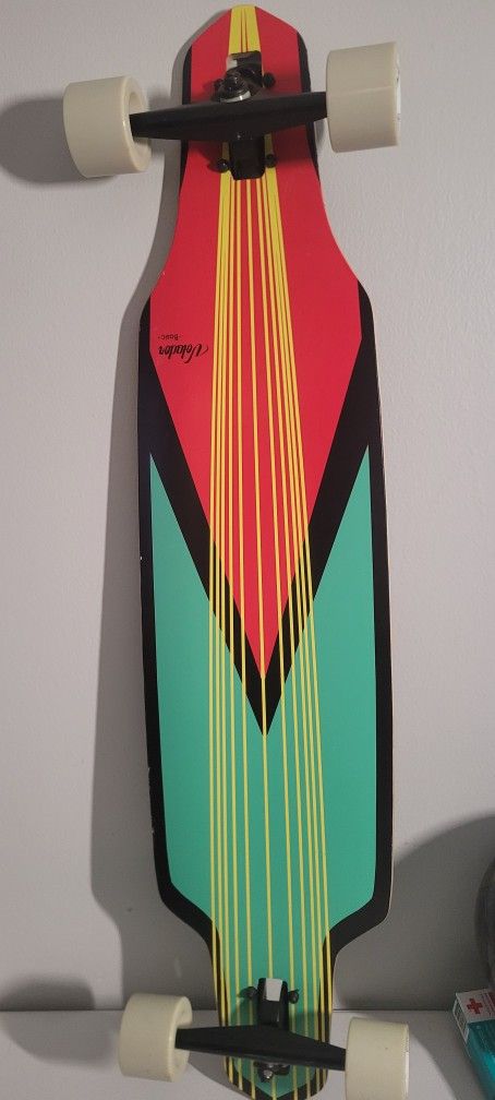Volador basics longboard -Whale on the grip tape, pink to yellow gradient bottom