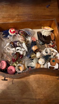 Wine rack, metal kitchen trinkets, food processor, toaster, microwave and stand, napkin rings, placemats and table cloths, silverware