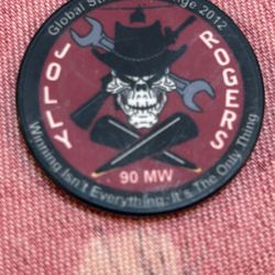 Commemorative coin from the 2012 "Jolly Rogers" Global Strike Challenge, highlighting a 90 MW power generation achievement.