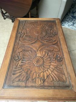Glass top table, has crack in the wood under the glass