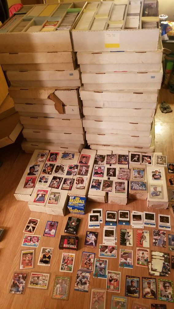 100,000 baseball cards, some football and few basketball cards. multiple ken griffey jr rookies, Jeter, etc...