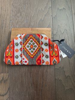 Chloe & Lex Orange Patterned Woven Clutch