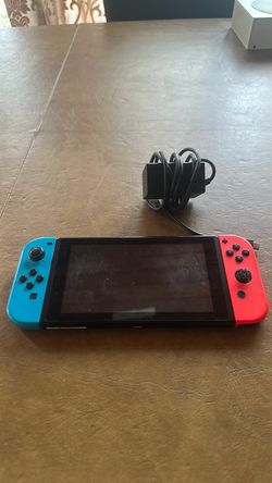 Nintendo Switch with Neon Joy-Cons and Charger