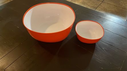 Orange-colored plastic mixing bowls