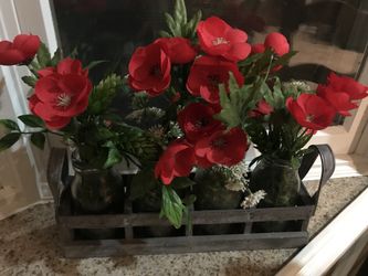 Vases of red flowers