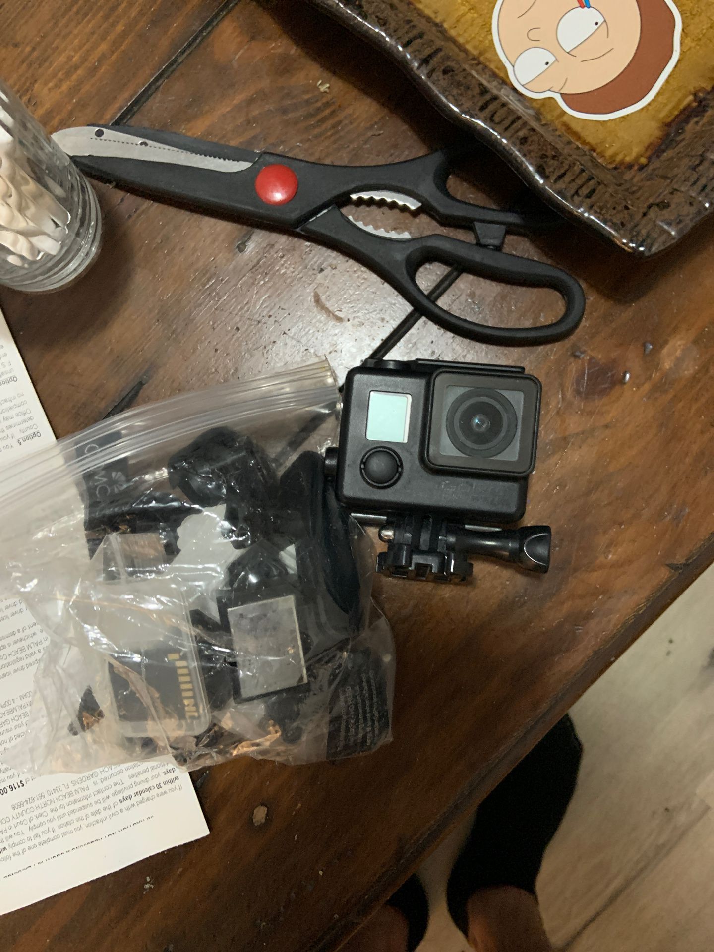 GoPro hero 3 with bag of extra batteries and parts
