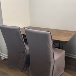 Dining room table & 2 chairs with covers 