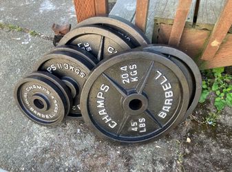 240lbs of Barbel weights 5’s - 45’s w/  Olympic bar 45lbs of weight