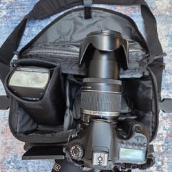 Canon EOS 60 D digital camera, 18-200mm lens, flash, camera bag, accessories 
MM