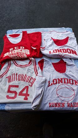 Assorted basketball jerseys and shorts