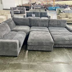 Grey Sectional Sofa With Oversized Chaise & Ottoman