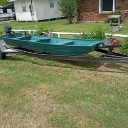 14 Ft Aluminum Sharpshooter With Live Well And Rod Holders With A 40 Mercury On The Back Next