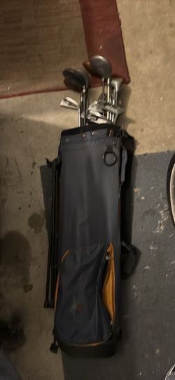 Golf bag with assorted golf clubs