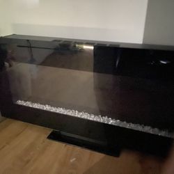 This Electric Fireplace Provides Heat And A Beautiful Look, It Looks Amazing When It’s Fitted Into Any Type Of Wall, Or It Cane Be Used On It’s Stand 