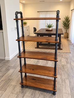Industrial Rustic 5-Tier Wood & Metal Pipe Bookshelf  Beautiful industrial-style shelving unit featuring rustic wood shelves and black metal pipe supp