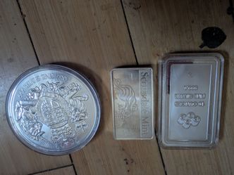 10 oz silver bars and round coin.