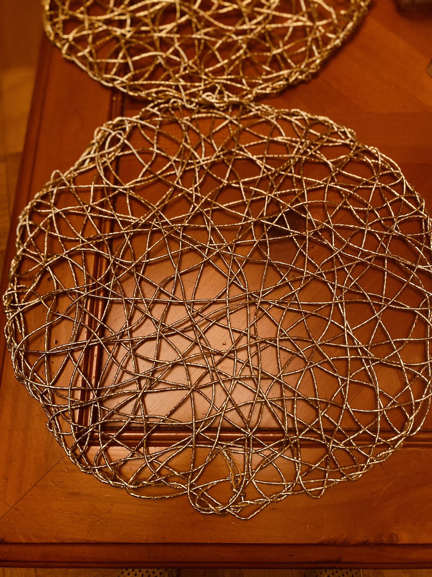 Gold Decorative Placemats (Set of 2), 13” diameter.