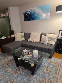 Rectangular glass top coffee table with black wood base