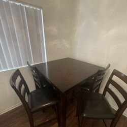 Wooden Table With Four Chairs