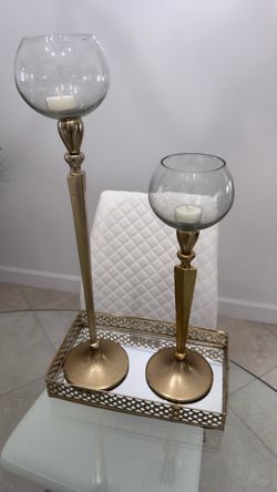 Candelabra, candle and jar with plastic flowers