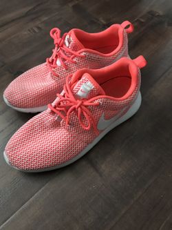 Neon pink Nike shoes