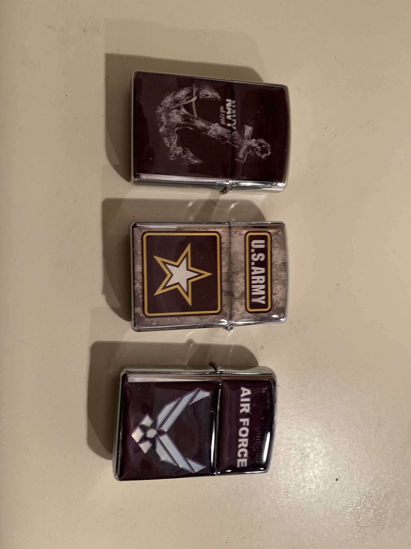 Army navy and Air Force zippo. Set.