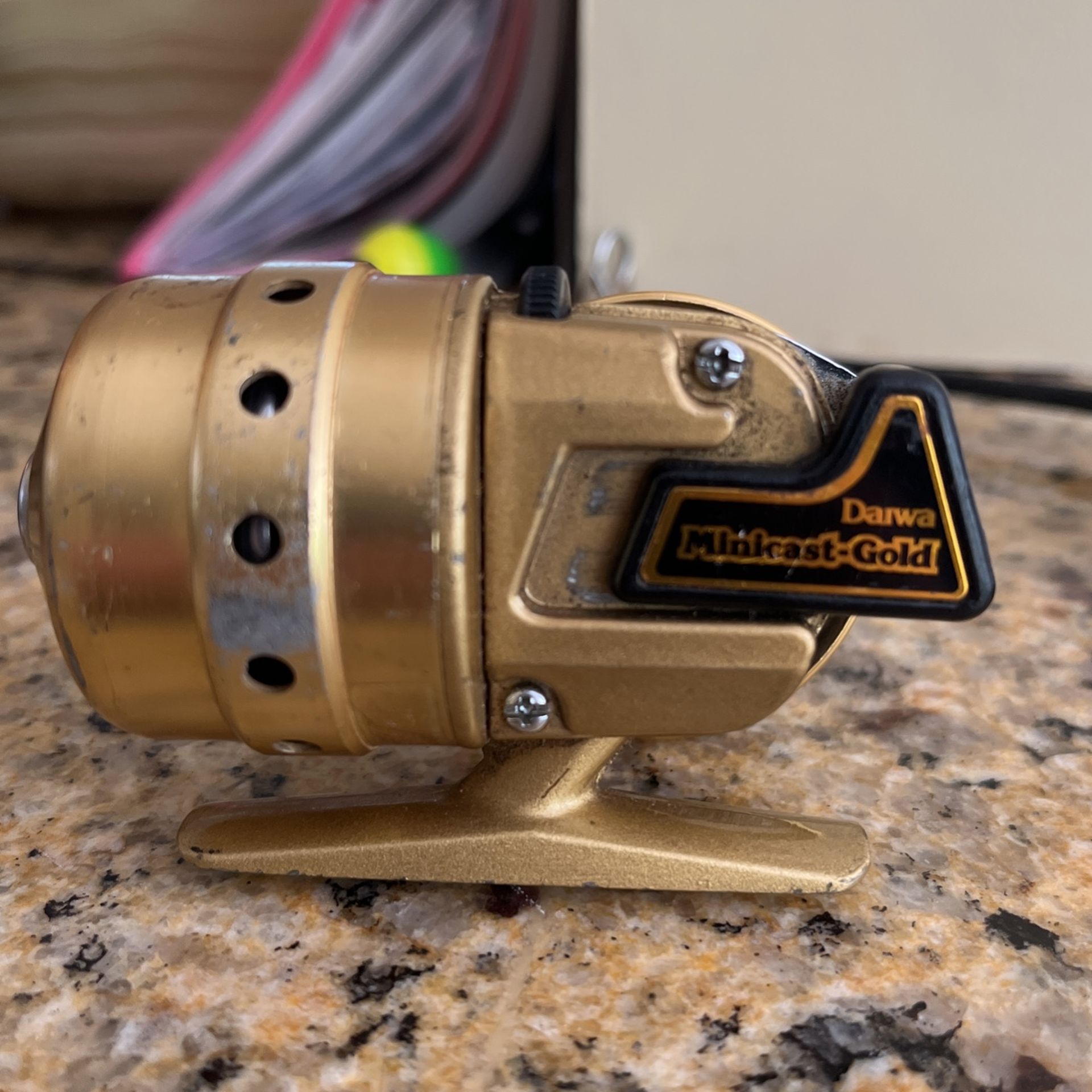 Vintage Daiwa Mini cast Gold Spin cast Reel for Sale in Milford, CT