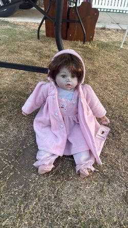 Porcelain Baby Doll in Pink Outfit