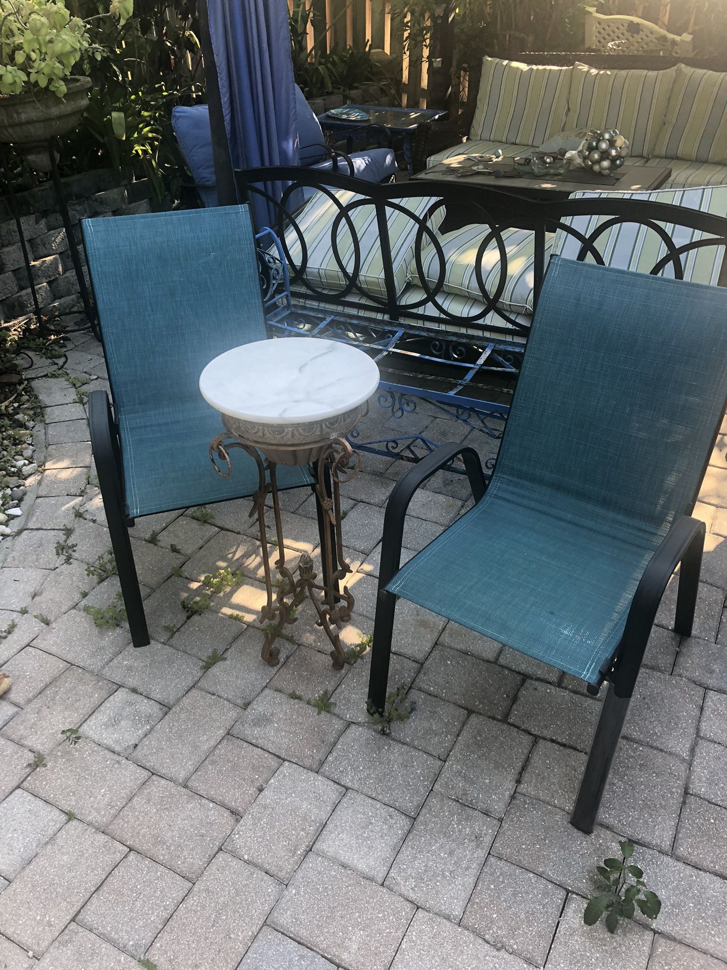 Two Outdoor Chairs With Marble Topped Table