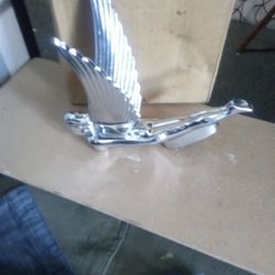 Flying Goddess" hood ornament, 