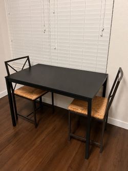 Black IKEA table with chairs