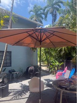 This solar LED 11 ft 8 panel Best Choice Products patio umbrella with base