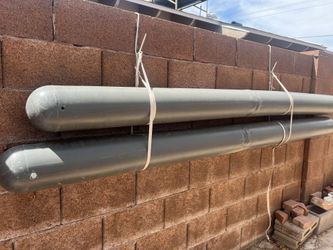 Large Gray PVC Pipes with Capped Ends