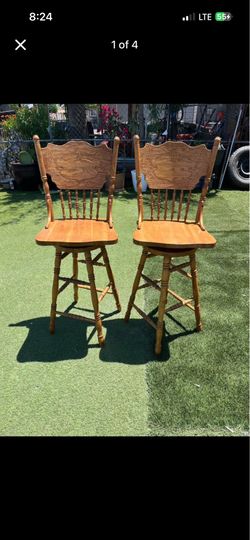 Pair of Carved Wood Swivel Bar Stools