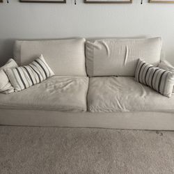 Beige sofa with pillows included