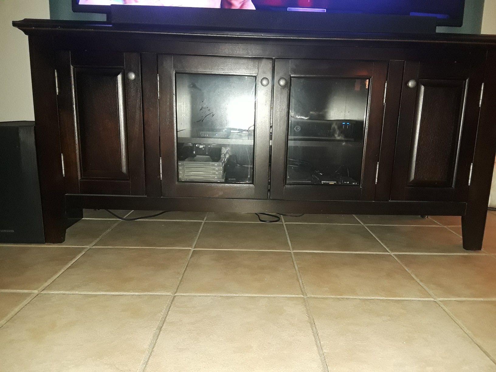 Tv stand holds 55 to 60 inch tv for 100 mint condition
