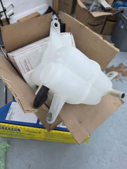 Brand new. 20o3 Cadillac CTS radiator coolant reservoir.  NEW
