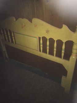 Yellow wooden bed headboard with matching mirror