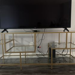 Henn&Hart Rectangular TV Stand with Glass Shelves for 65' TVs in Brass