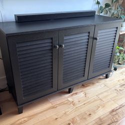 Black wood TV stand / shoe storage cabinet