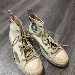 white and green platform converse