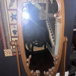 Ornate oak cheval floor mirror