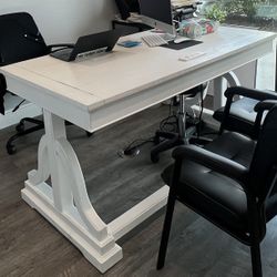 Large wooden executive-style desk in white finish., solid and well built.