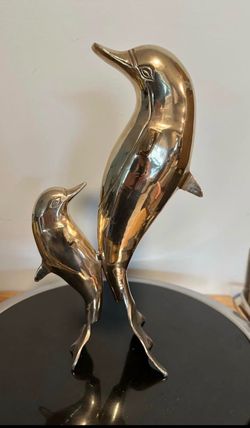 11” brass pair of dolphins