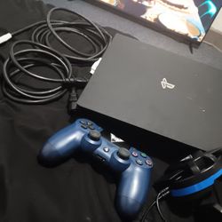 Tv And Playstation 4 With Head Phones And Controller 